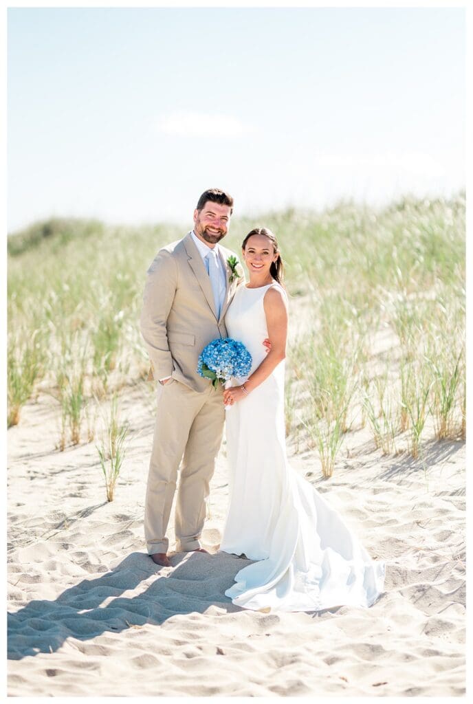 Couple smiling and holding each other on beach