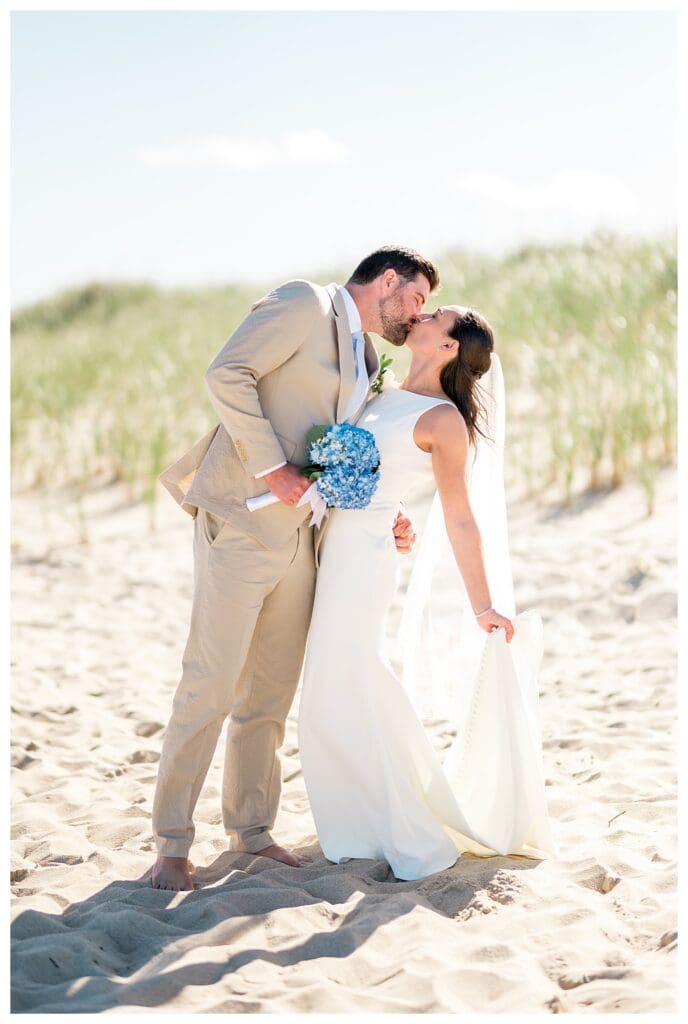 Couple kissing on beach with soft light