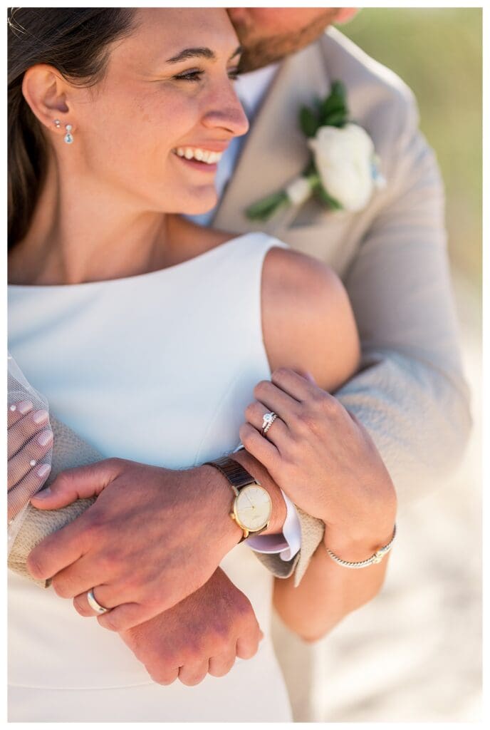 Close up of couple embracing beach portrait