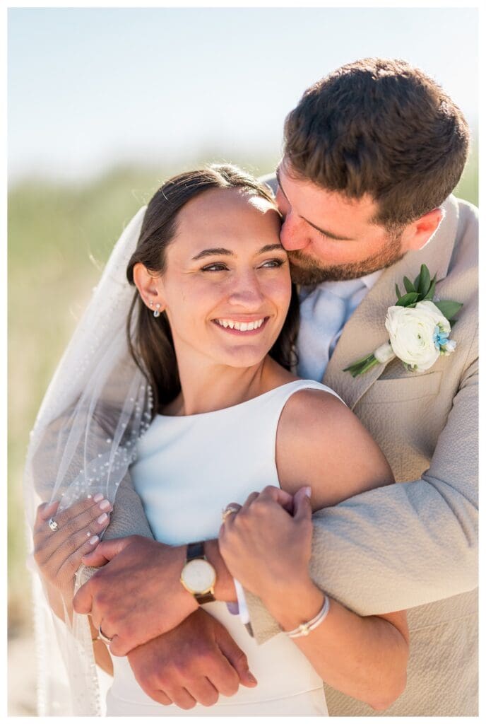 Couple hugging and smiling candid