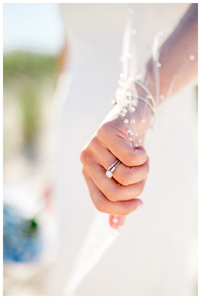 Wedding ring detail on bride’s hand