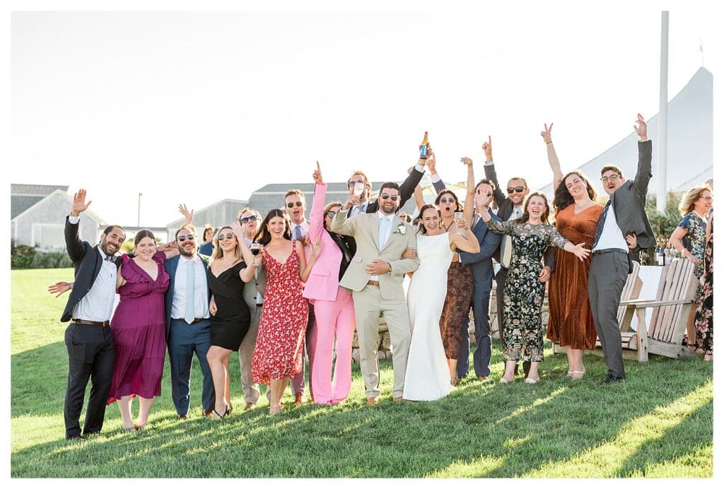Wedding guests cheering group photo