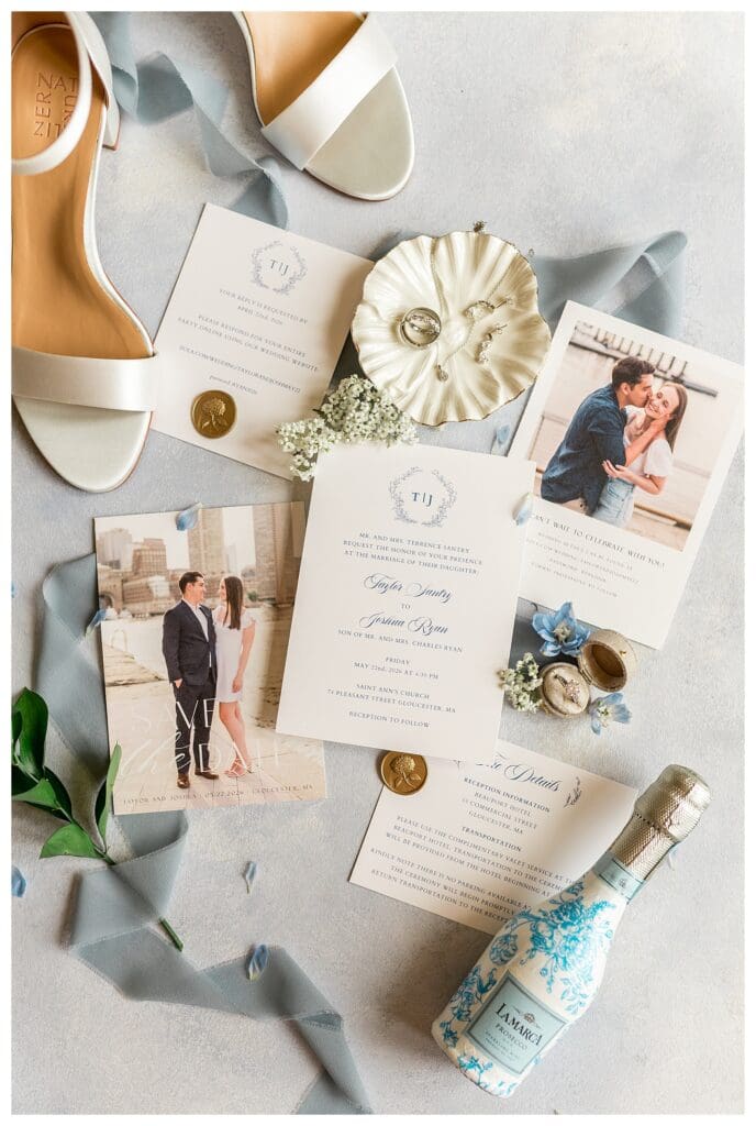 Flat lay of wedding invitations, shoes, and heirloom details