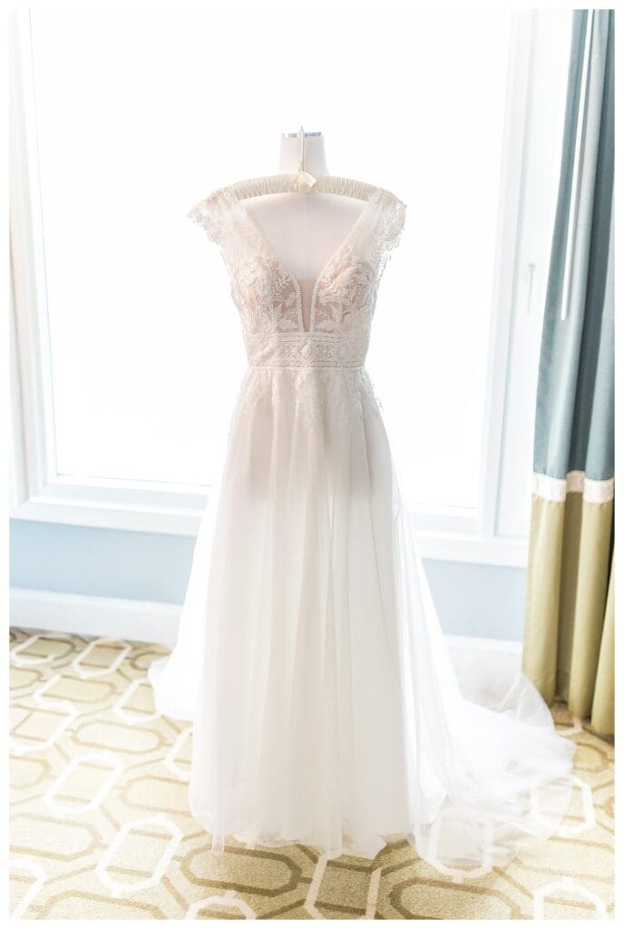 White wedding gown on a dress form in bridal suite at Boston Harbor Hotel