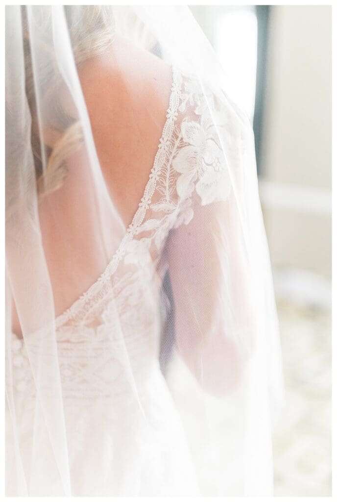 Close-up detail of bride's lace wedding gown at Boston Harbor Hotel