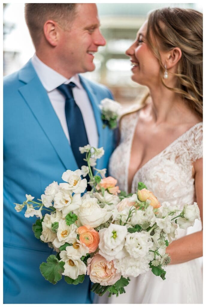 Groom looking at bride affectionately during Boston Harbor Hotel wedding portraits