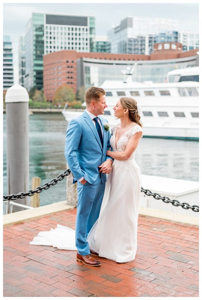 Bride and groom portrait with Boston Harbor waterfront and skyline in background
