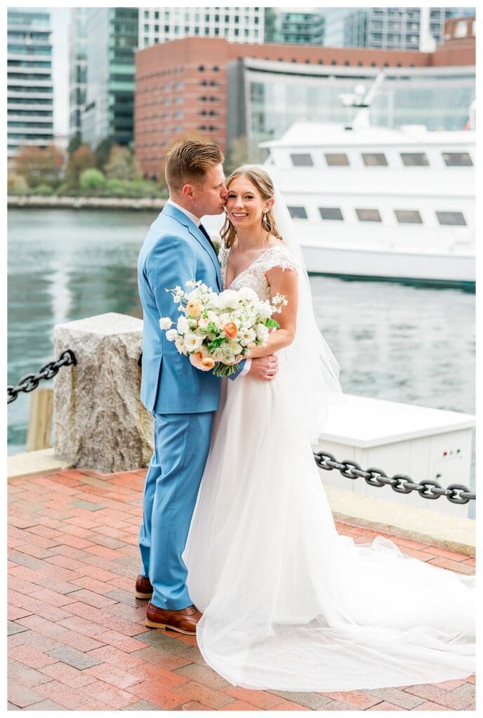 Bride and groom portraits on the waterfront walkway at Boston Harbor Hotel