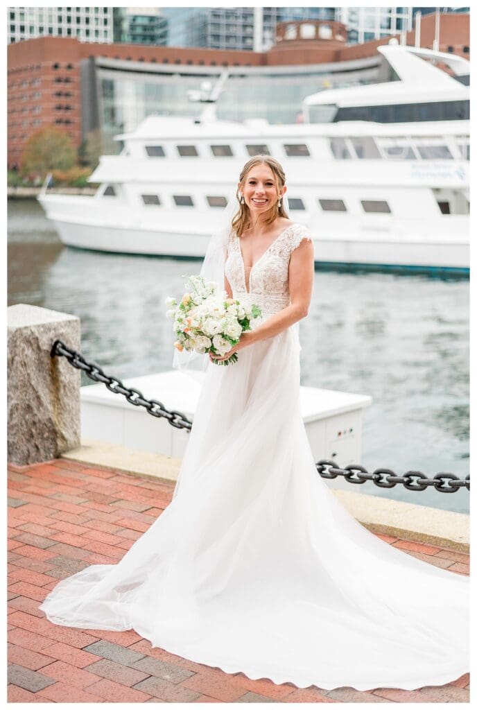 Bride smiling and laughing during outdoor portraits at Boston Harbor Hotel
