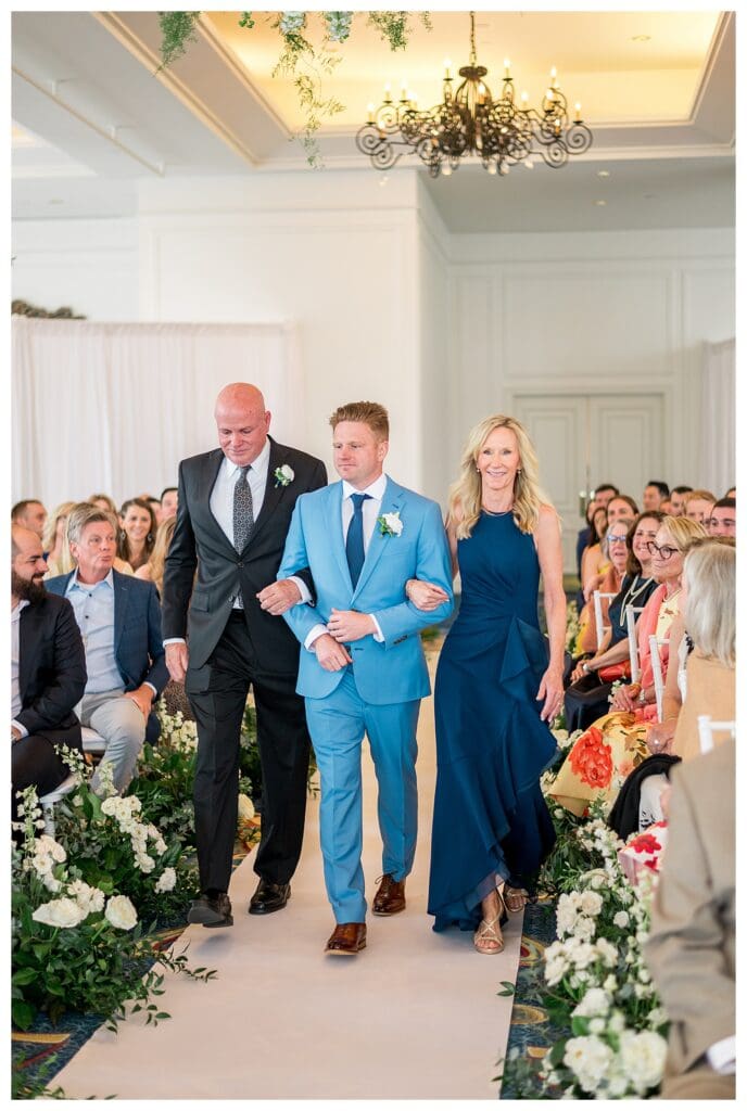 Wedding ceremony processional at Boston Harbor Hotel with guests watching