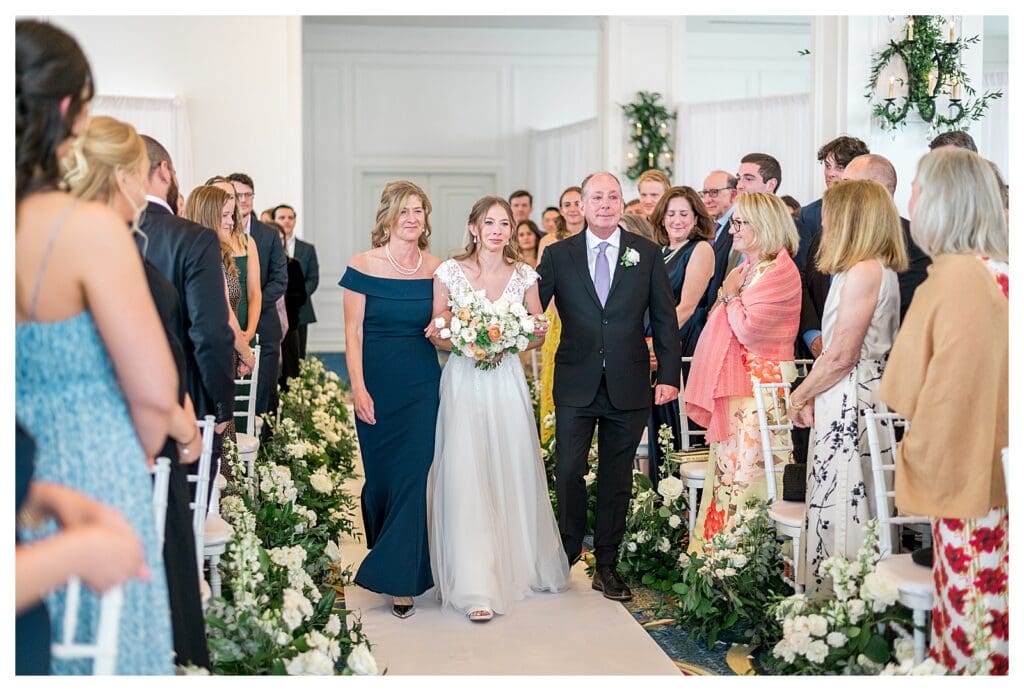 Mother and Father walking bride down the aisle at Boston Harbor Hotel wedding ceremony
