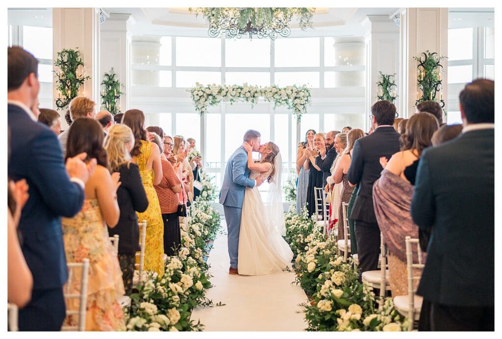 Bride and groom recessional down the aisle at Boston Harbor Hotel