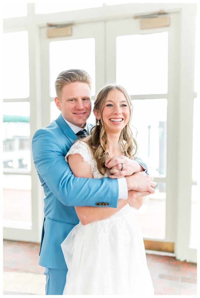 Bride and groom romantic portrait on the Boston Harbor Hotel waterfront