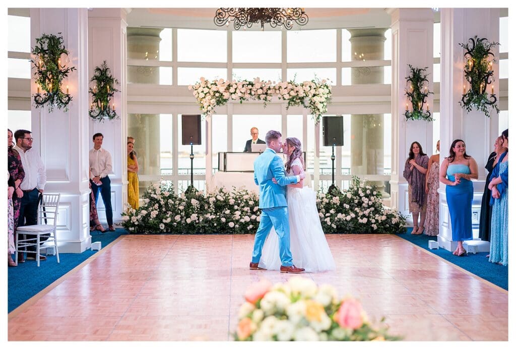Bride and groom embracing and smiling during first dance at Boston Harbor Hotel