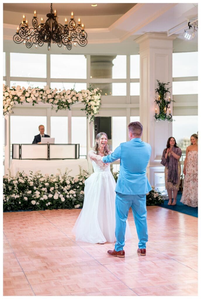 Bride and groom first dance surrounded by guests at Boston Harbor Hotel reception