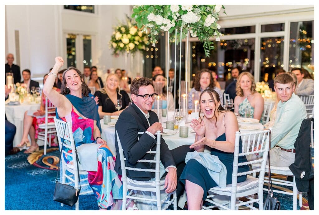 Guests seated and celebrating during reception at Boston Harbor Hotel