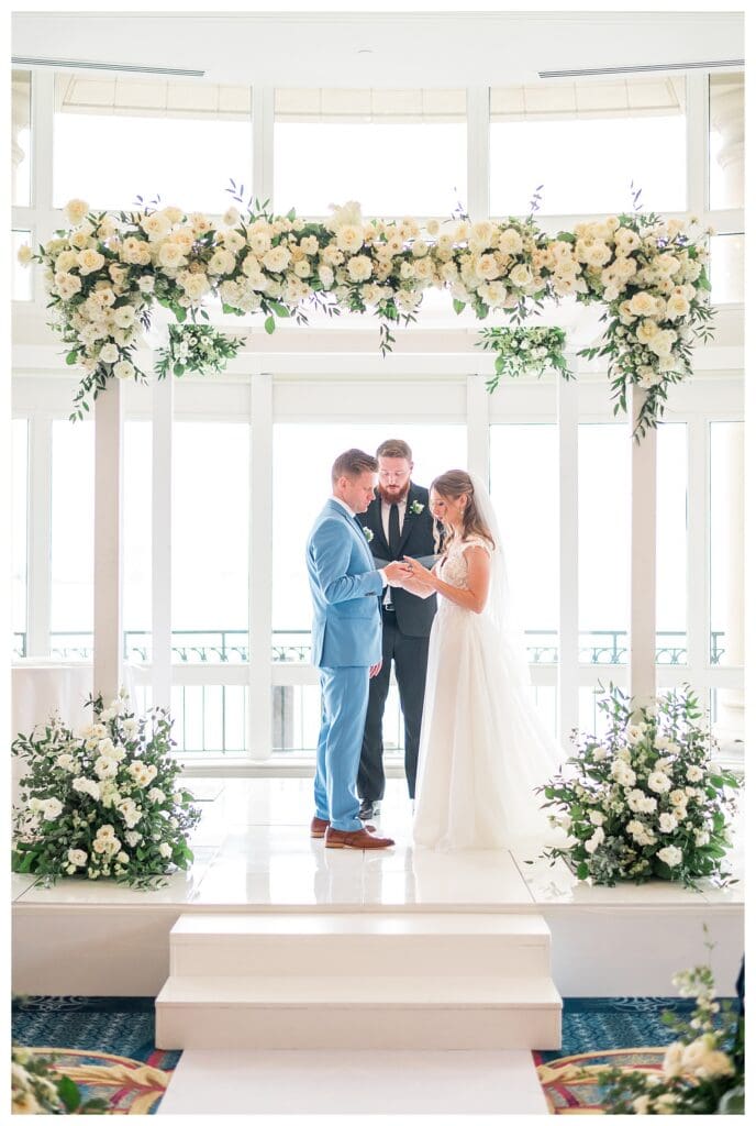 Bride and groom exchanging vows under chuppah at Boston Harbor Hotel