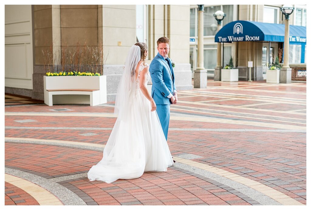 Groom turning to see his bride for the first time in Boston, MA.