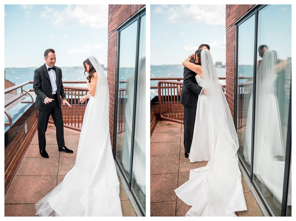 Bride and groom embracing on a Boston rooftop terrace with boats visible on the water.