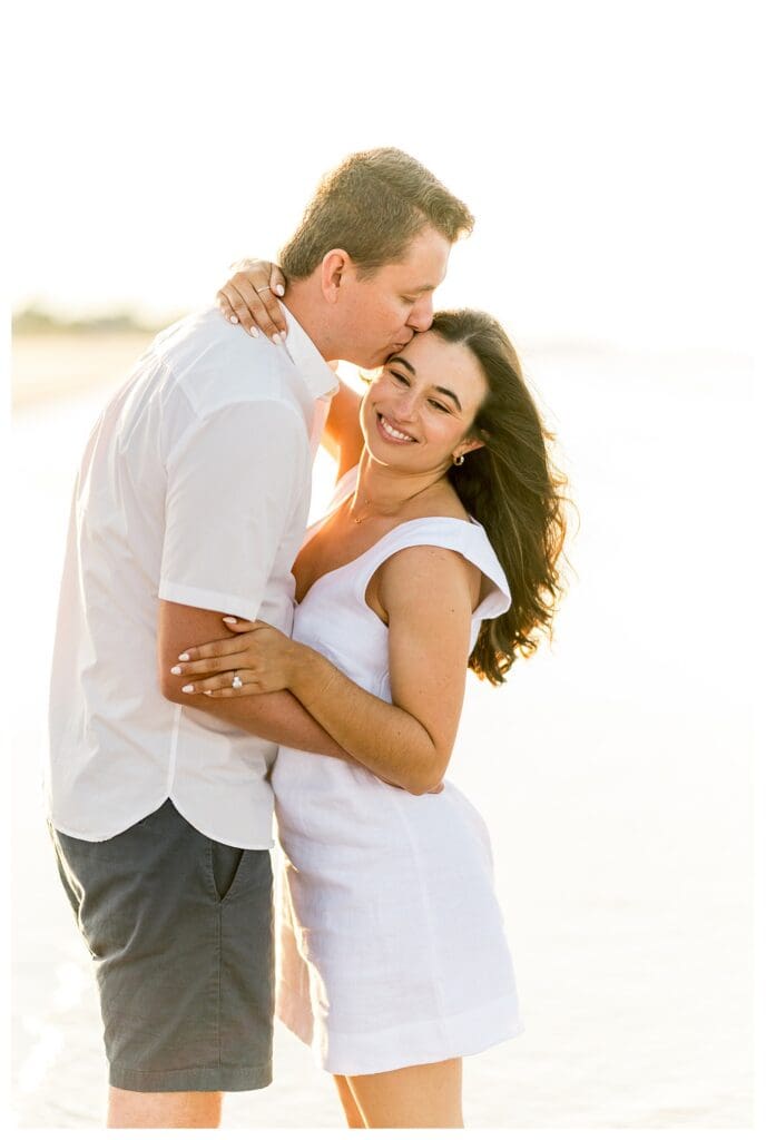 Romantic embrace on the beach during a Massachusetts engagement session