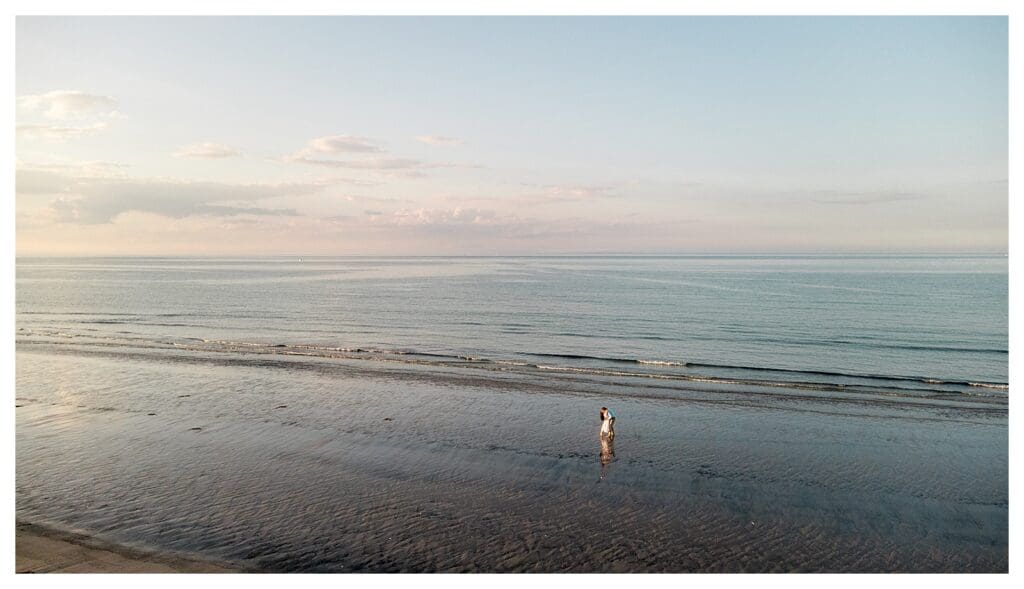 Drone view of a quiet Massachusetts beach during an engagement session