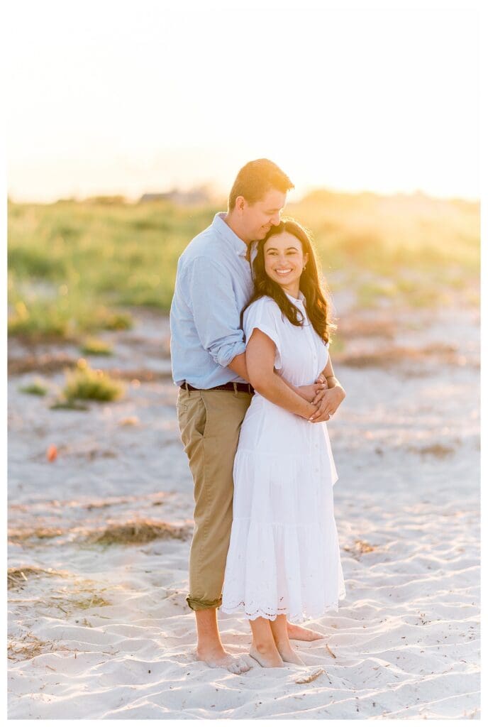 Smiling and cuddling together during a Gloucester engagement session