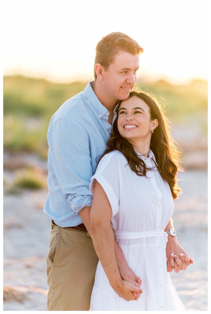 Romantic embrace on the beach during sunset